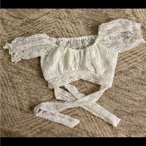 White short sleeve crop top that wraps around the front and ties in back